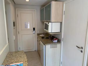 Una cocina o kitchenette en Jurerê Beach Village - Flat na Praia