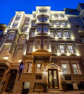 a tall building with lights on the side of it at The Soul Istanbul Hotel in Istanbul