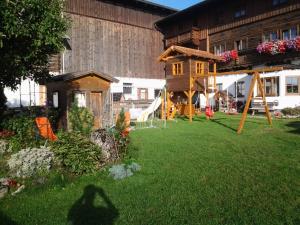 a shadow of a person in the yard of a house at Nöglhof in Radstadt