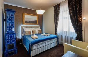 Кровать или кровати в номере Boutique Hotel Chrysso