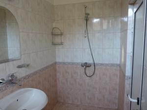 a bathroom with a shower and a sink at Guest House Zhelevi in Sozopol