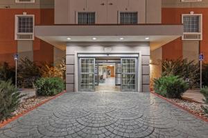 a lobby of a hotel with doors open at Candlewood Amarillo-Western Crossing, an IHG Hotel in Amarillo