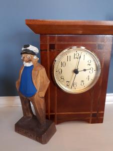 a figurine of a man standing next to a clock at Hillside Landing B&B in Digby