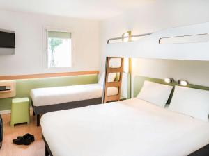 Hôtel Ibis Budget Nantes Nord St Herblain 객실 침대