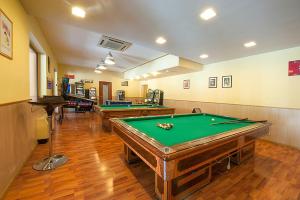 a room with three pool tables in it at Hotel Plestina Ristorante Pizzeria in Foligno