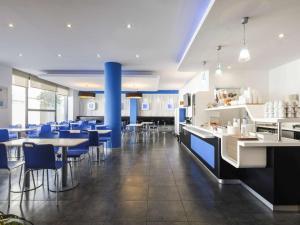 Un restaurant u otro lugar para comer en Ibis Budget Málaga Centro