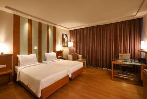 Posteľ alebo postele v izbe v ubytovaní Radisson Blu Hotel Chennai City Centre