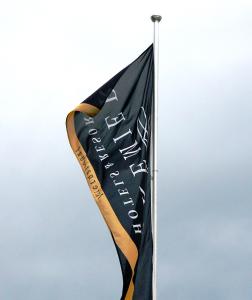 a black flag on a pole in the sky at Premier Hotel The Richards in Richards Bay