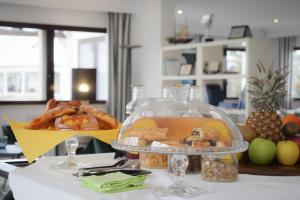 a plate of food on a table with a plate of food at Porto Romano - The Marina Resort in Fiumicino