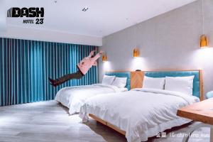 Ένα ή περισσότερα κρεβάτια σε δωμάτιο στο Dash 23 Hotel