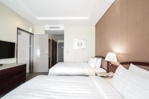 Tempat tidur dalam kamar di Best Western Premier Gangnam Hotel