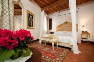 Giường trong phòng chung tại Hotel San Miniato