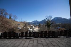 a wooden fence with a view of a mountain at Haus Bergland in St. Wolfgang