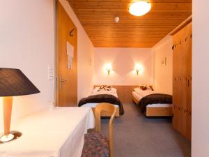 Postelja oz. postelje v sobi nastanitve Hotel Oberland