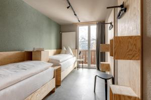 A bed or beds in a room at Belmont- Apartment Haus