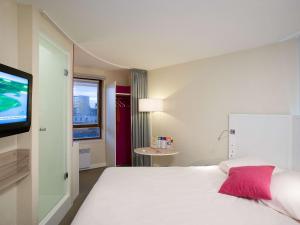 Ένα ή περισσότερα κρεβάτια σε δωμάτιο στο ibis Styles Lille Centre Gare Beffroi