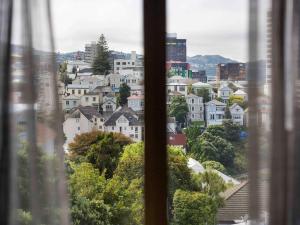 a view of a city from a window at Mövenpick Hotel Wellington in Wellington