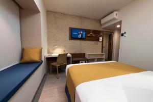 Krevet ili kreveti u jedinici u okviru objekta Microtel Inn & Suites by Wyndham San Luis Potosi