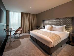 Cama ou camas em um quarto em Pullman Brisbane Airport