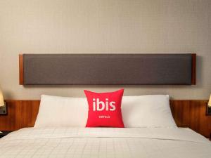 En eller flere senge i et værelse på Ibis Ambassador Myeongdong