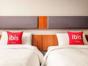 En eller flere senge i et værelse på Ibis Ambassador Myeongdong