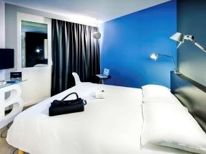 Ένα ή περισσότερα κρεβάτια σε δωμάτιο στο ibis Styles Brest Centre Port