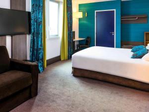 Giường trong phòng chung tại Ibis Styles Lyon Centre - Gare Part Dieu