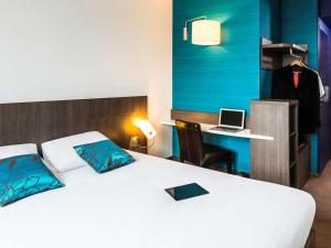 Giường trong phòng chung tại Ibis Styles Lyon Centre - Gare Part Dieu