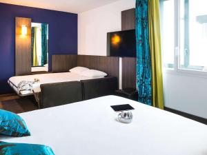 Giường trong phòng chung tại Ibis Styles Lyon Centre - Gare Part Dieu