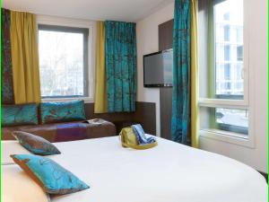 Giường trong phòng chung tại Ibis Styles Lyon Centre - Gare Part Dieu