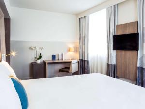 Katil atau katil-katil dalam bilik di Novotel SPA Rennes Centre Gare