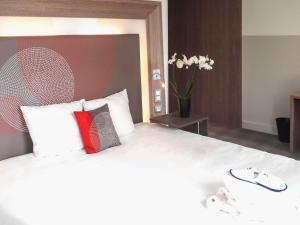 Katil atau katil-katil dalam bilik di Novotel SPA Rennes Centre Gare