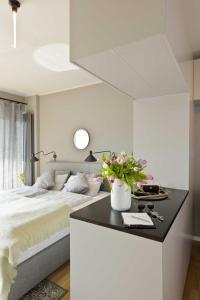 Design-Apartment an der Strandallee nur 50 Meter vom Strand客房内的一张或多张床位