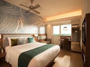 ibis Styles Goa Calangute - An Accor Brand tesisinde bir odada yatak veya yataklar