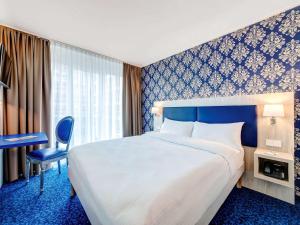 سرير أو أسرّة في غرفة في ibis Styles Rastatt Baden-Baden