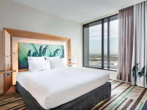 Posteľ alebo postele v izbe v ubytovaní Novotel Auckland Airport