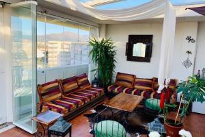 a living room with couches and a table at Les Marines in Roses