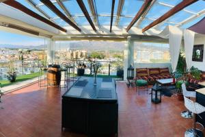 a living room with a view of a city at Les Marines in Roses