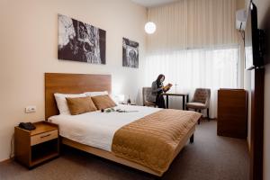 Кровать или кровати в номере Sajam Garni hotel