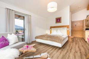 Ein Bett oder Betten in einem Zimmer der Unterkunft Enjoy The Alps