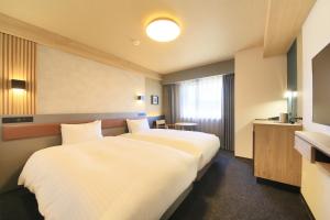 Ліжко або ліжка в номері Richmond Hotel Yamagata Ekimae