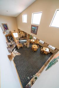 an aerial view of a living room with a deer on the floor at Alpine Inn & Suites Gunnison in Gunnison