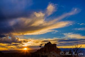 a sunset over a mountain in the desert at Alpine Inn & Suites Gunnison in Gunnison