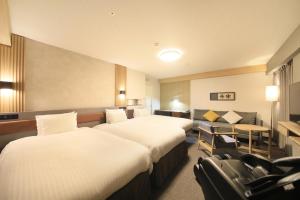 Ліжко або ліжка в номері Richmond Hotel Yamagata Ekimae