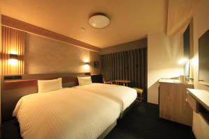 Ліжко або ліжка в номері Richmond Hotel Yamagata Ekimae