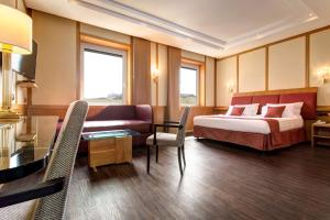 Un pat sau paturi într-o cameră la Best Western Hotel President - Colosseo