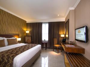 Lova arba lovos apgyvendinimo įstaigoje The Victoria Hotel Yogyakarta