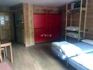 Krevet ili kreveti u jedinici u okviru objekta House Cervinia Apartments