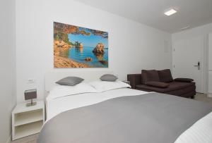 Tempat tidur dalam kamar di Villa Dalmatia Apartments