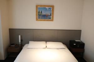 Katil atau katil-katil dalam bilik di Hotel Thomas Myeongdong